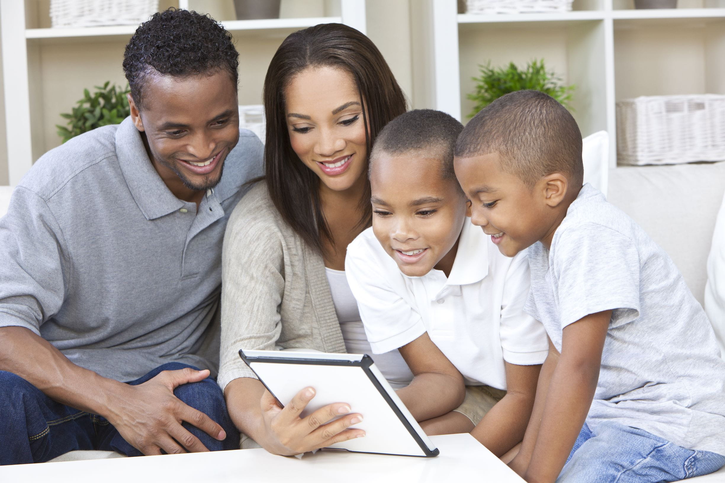 African american family looking at tablet