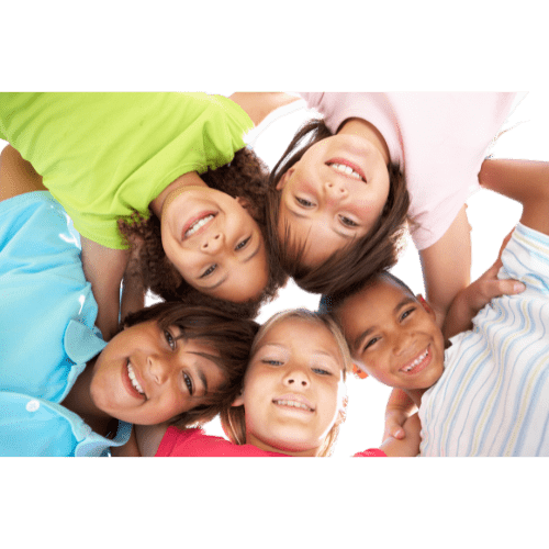 kids wearing bright colored shirts in a huddle