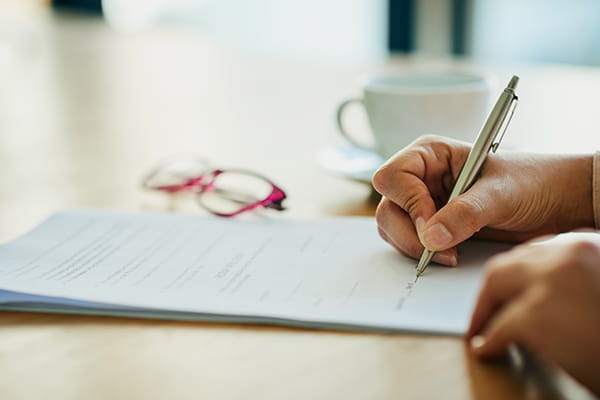 Person signing a legal document