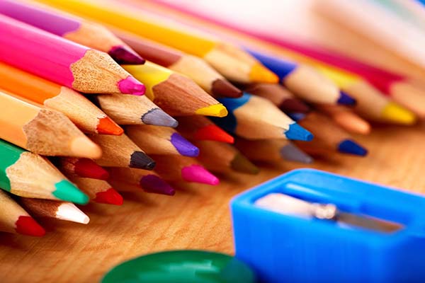 close up of colored pencils and sharpener