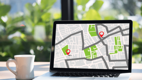 Photo of a laptop with a map on the screen.