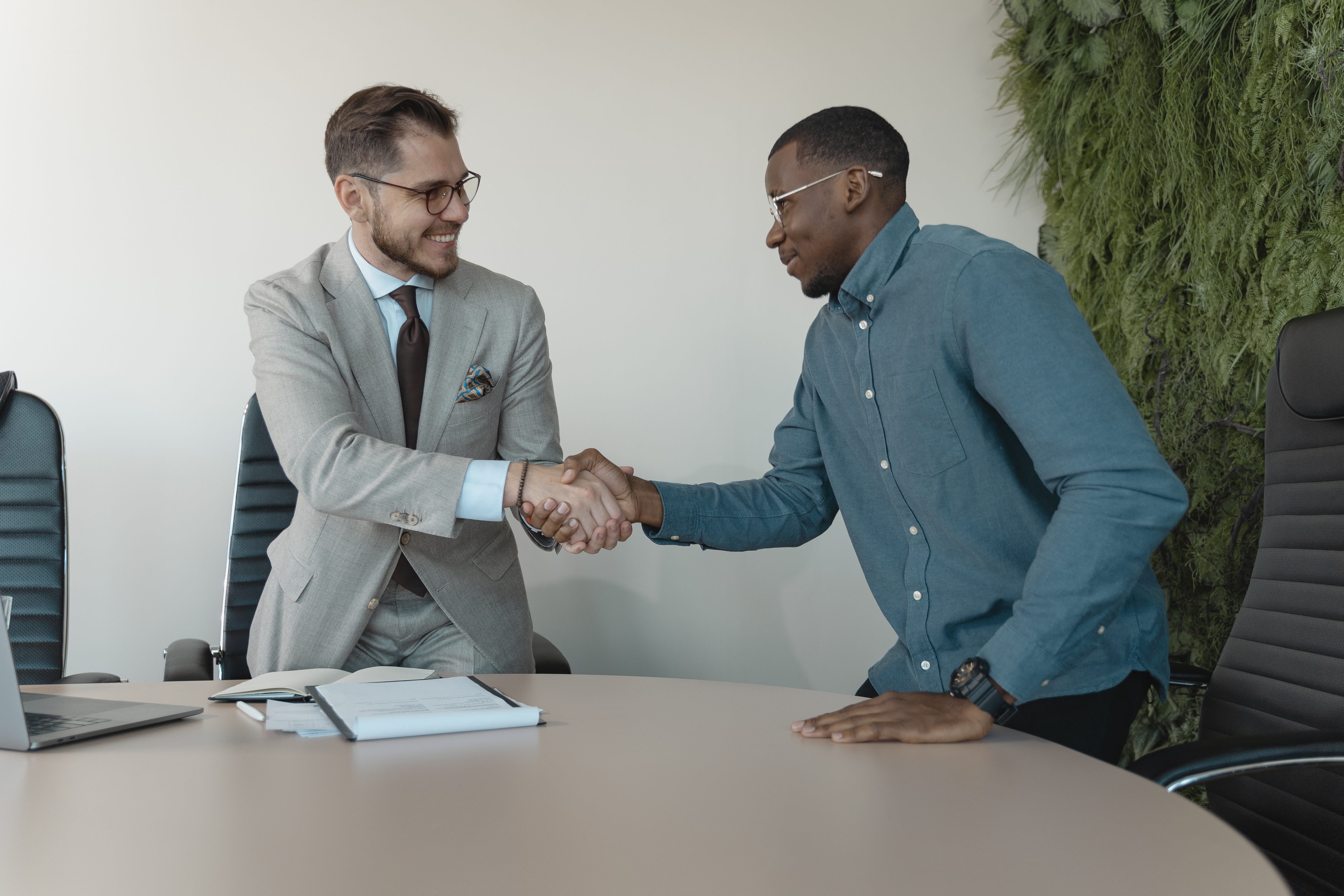 Image of two men shaking hands.