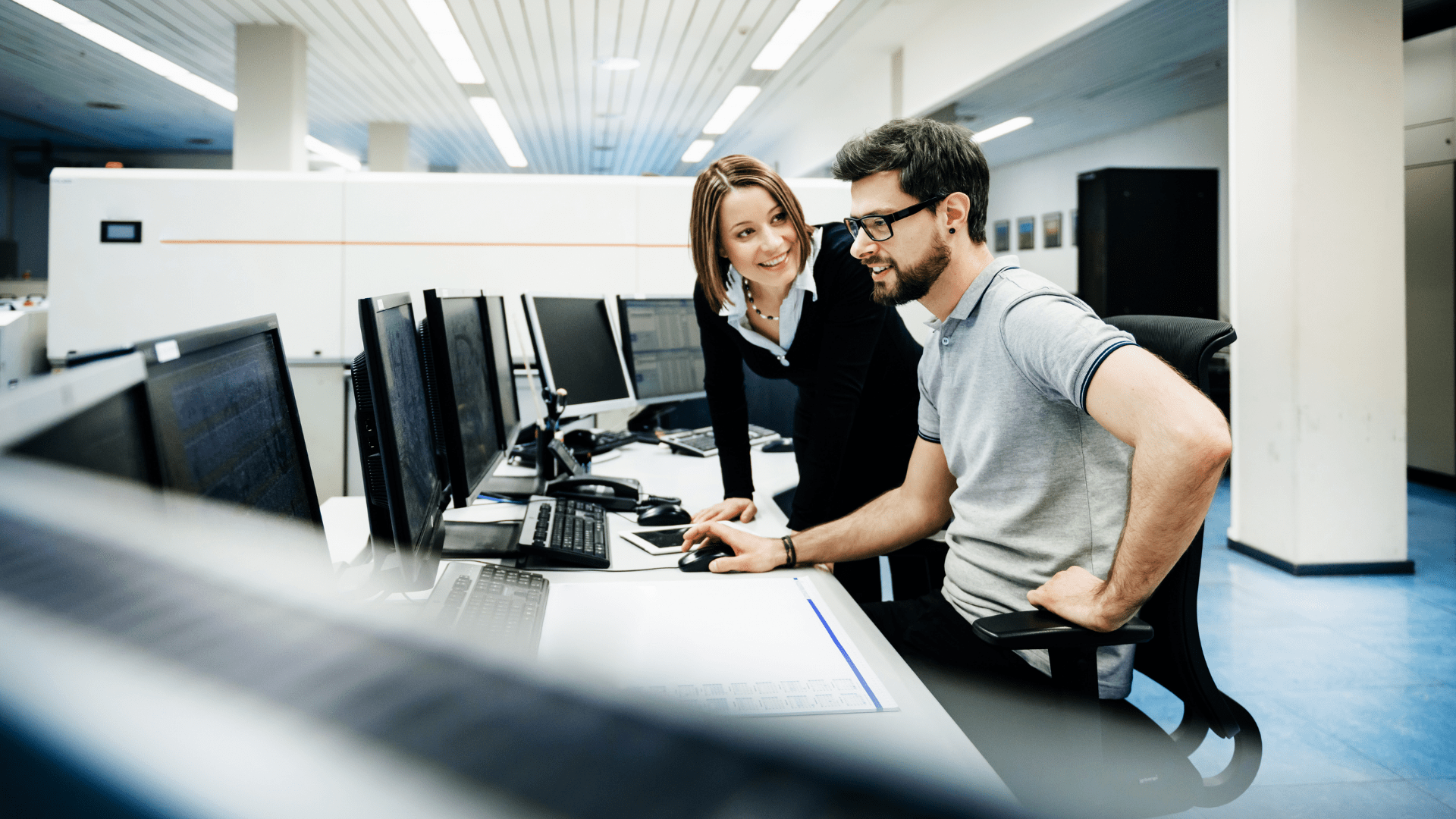 Photo of a man sitting and working at a computer.