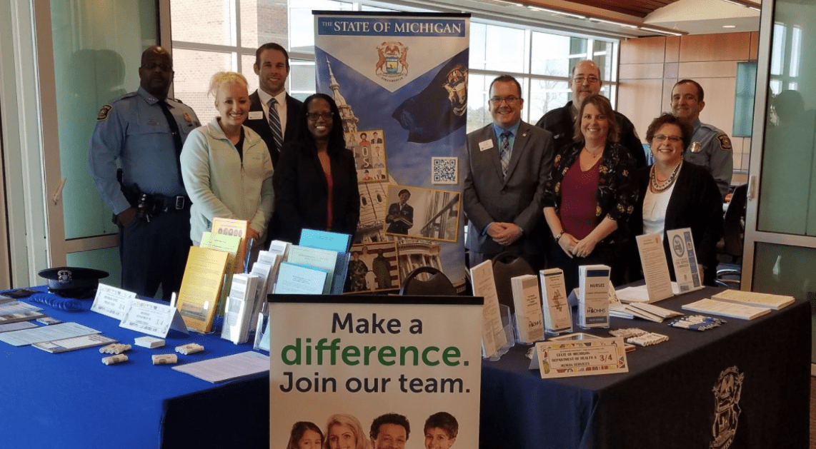 Photo of recruiters from the state of Michigan at a career fair.