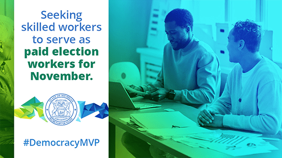 Seeking skilled workers to serve as paid election workers in November #Democracy MVP, picture of two people sitting behind a desk, working with a laptop