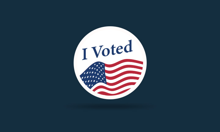 White "I voted" sticker with an American flag