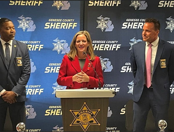 Deputy Sheriff Percy Glover and Secretary Benson and Sheriff Swanson