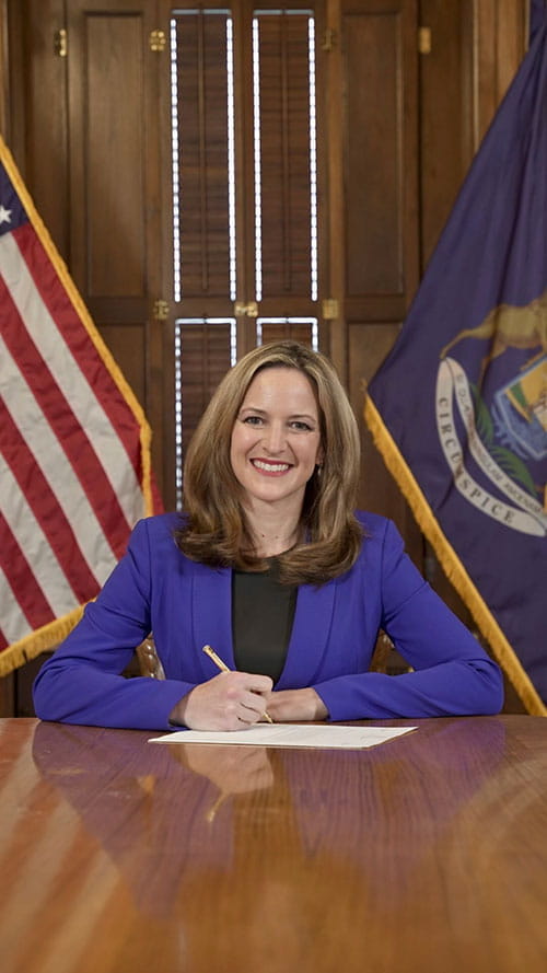 Secretary Benson signs legislation as acting Governor