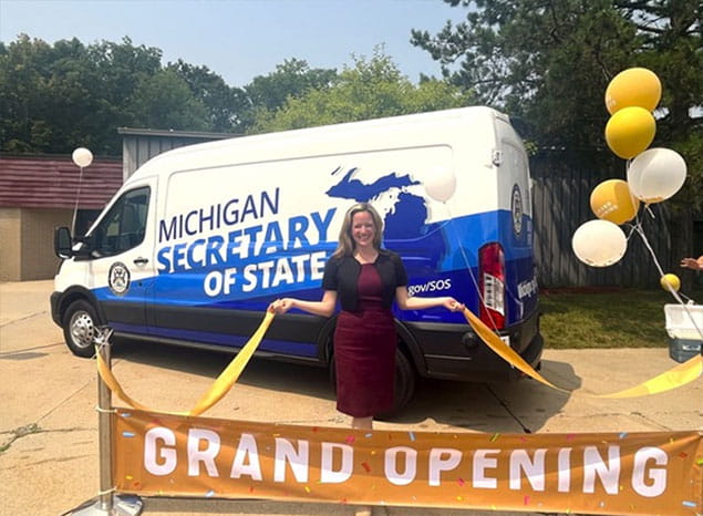 Secretary Benson celebrates the newest mobile office