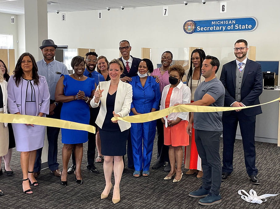 Secretary Benson cuts ribbons at office grand opening