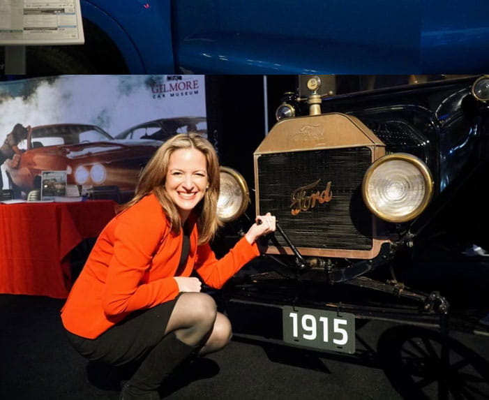 Benson looks at an antique car