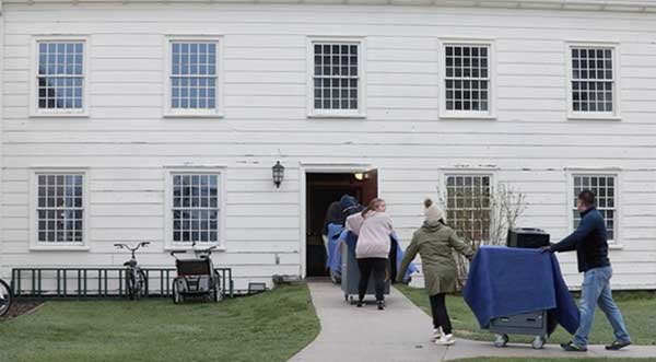 MDOS staff haul equipment when the mobile office makes its maiden voyage to Mackinac Island