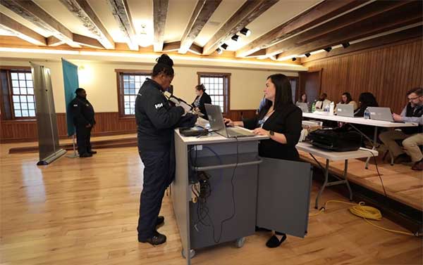 Secretary of State mobile office staff assist customers with transactions at the Mackinac Island Community Hall