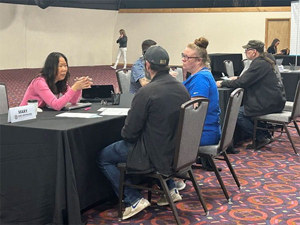 Mary Bryner with the MDOS OHAAO helps attendees