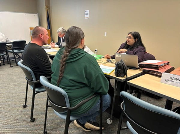 Rubina Mustafa assists attendee at Benton Harbor R2R clinic 2025