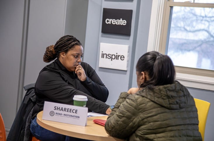 Ypsilanti Clinic Shareece McCauley assists attendee