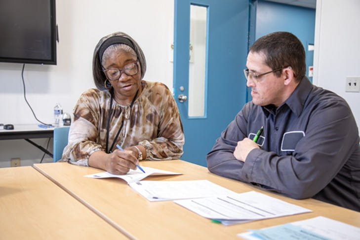 Ypsilanti Clinic - Sharon Seay with clinic attendee