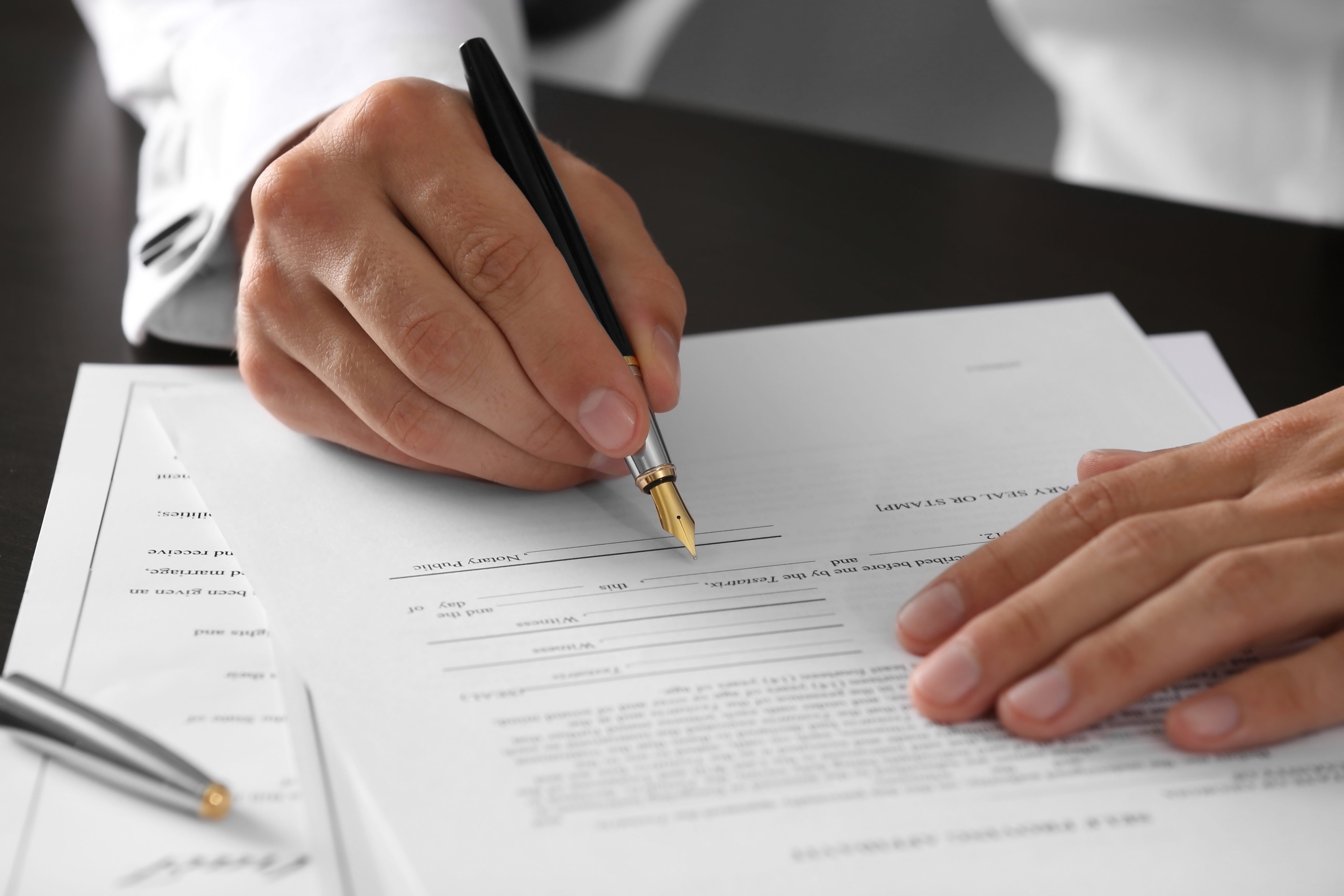 Person signing a form
