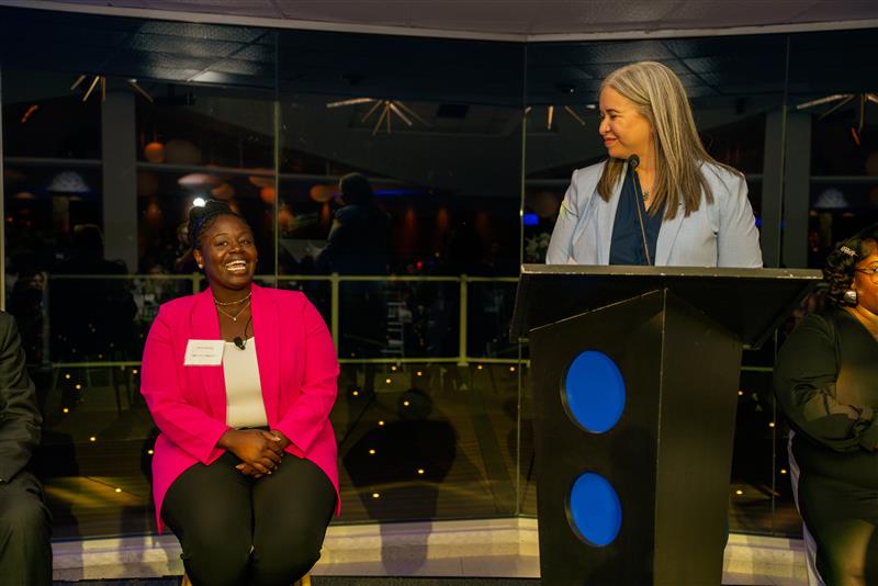 Panelist member Pura Strong and State Treasurer Rachael Eubanks converse during a panel discussion at the Fostering Futures Scholarship benefit dinner in Detroit on Sept. 12, 2025.