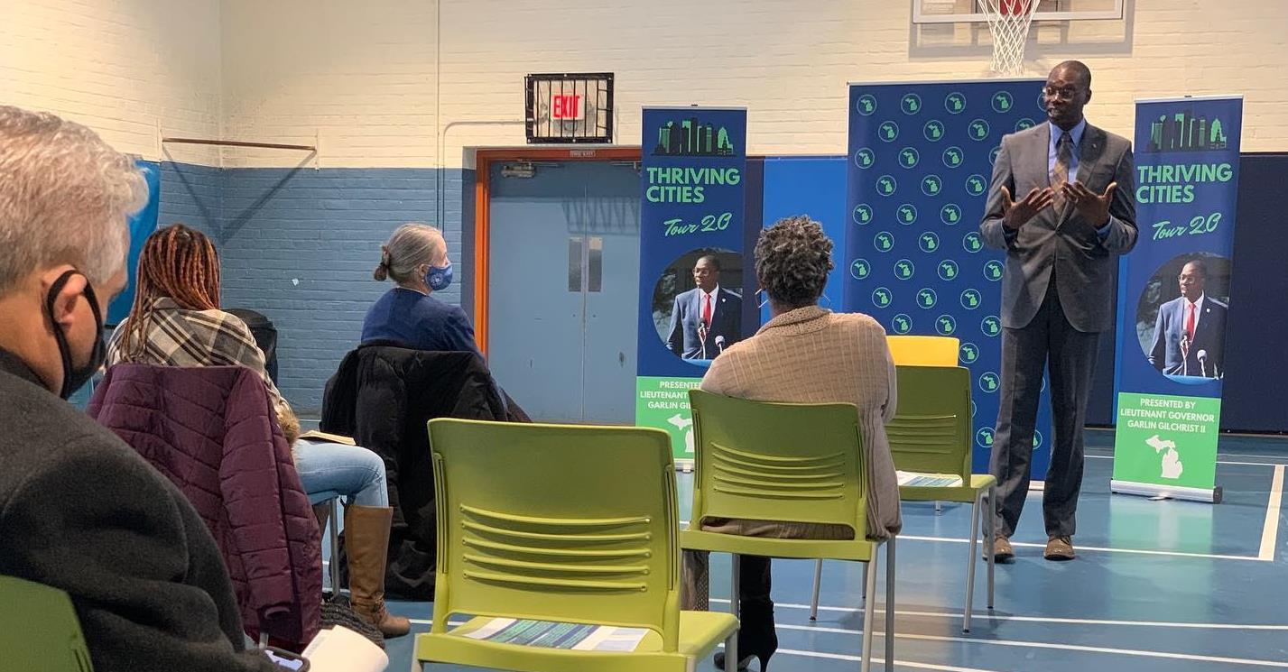 Lt. Governor Gilchrist speaking in front of residents at a local city event.