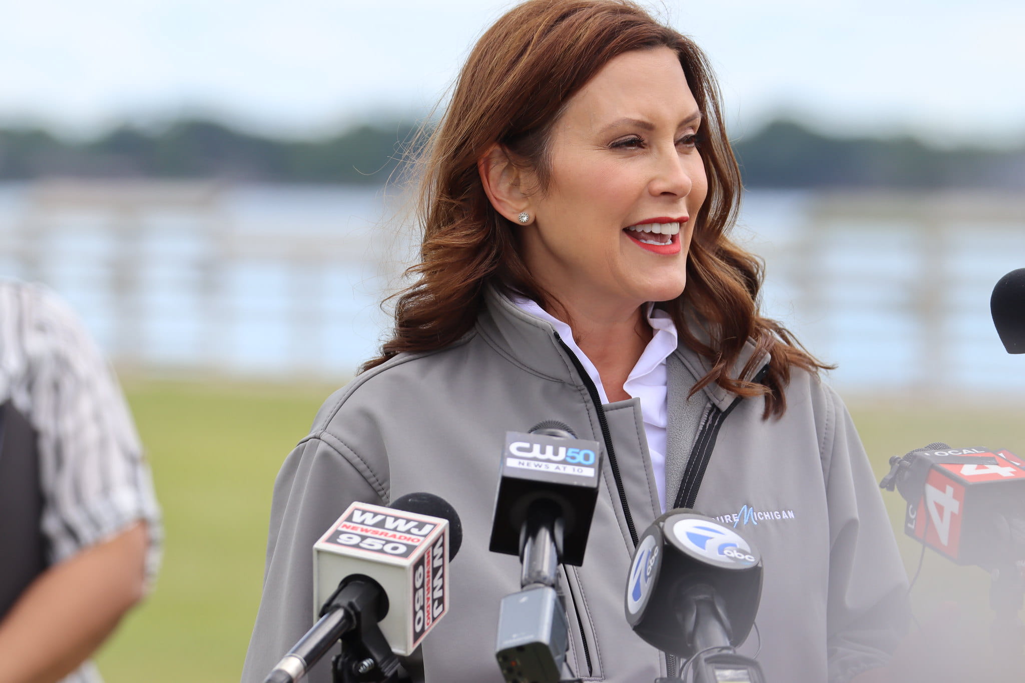 Photo of Governor Whitmer talking to the media at an event.