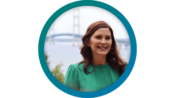 Headshot of Gov. Gretchen Whitmer in front of the Mackinac Bridge.