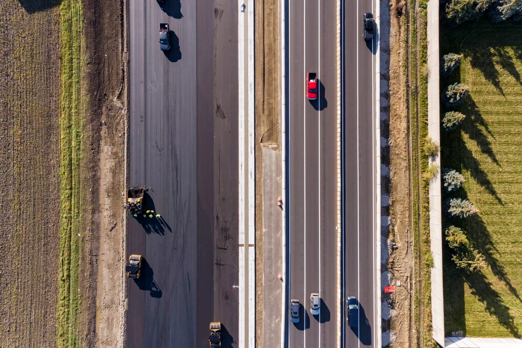 Photos of a road crew working on a project taken from the air.